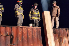 Firefighters in full gear on top of fire truck — chimney fire training February 2024