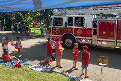 Kids with fire truck at community outreach event